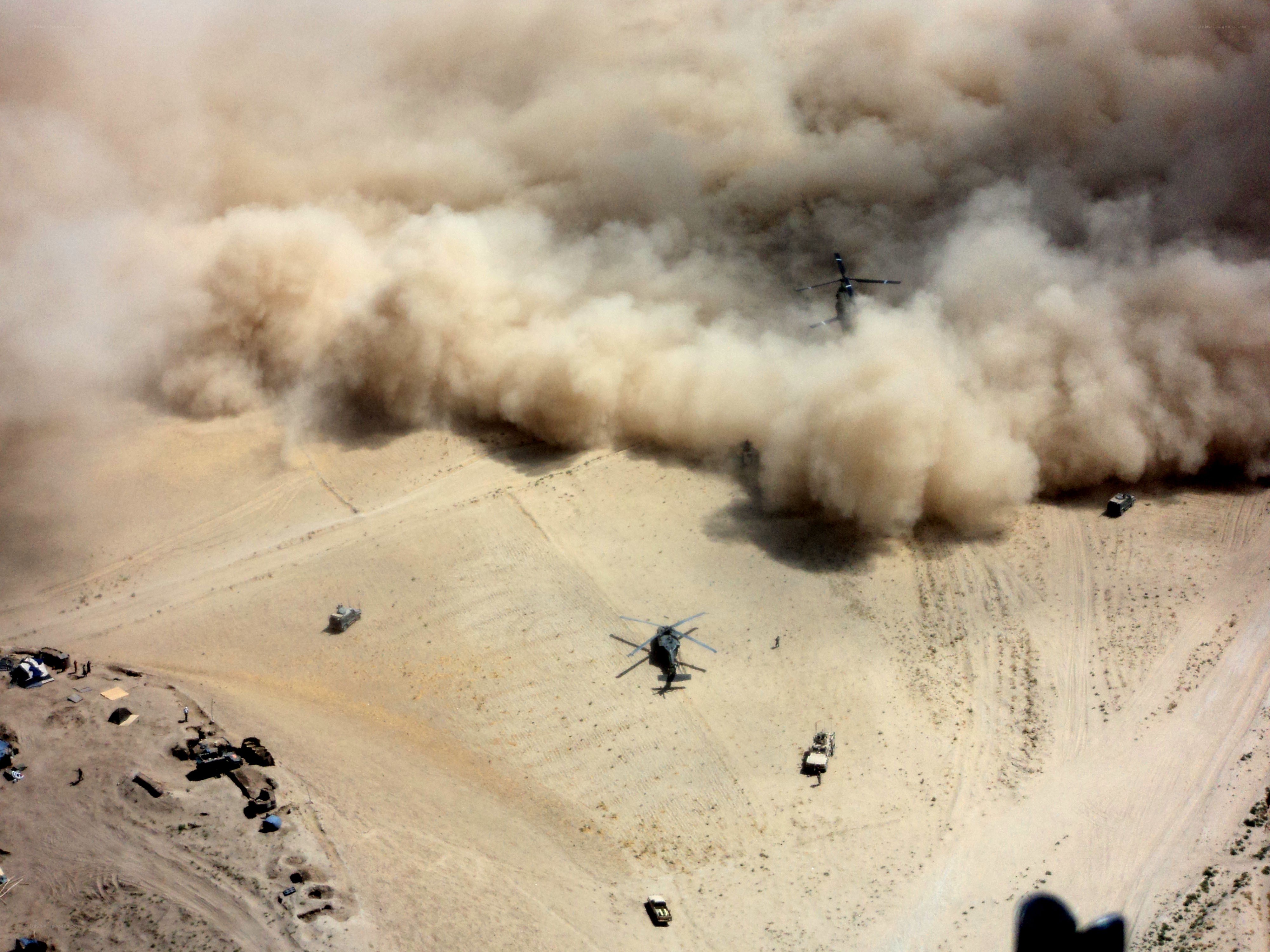 Helicopters in desert dust storm