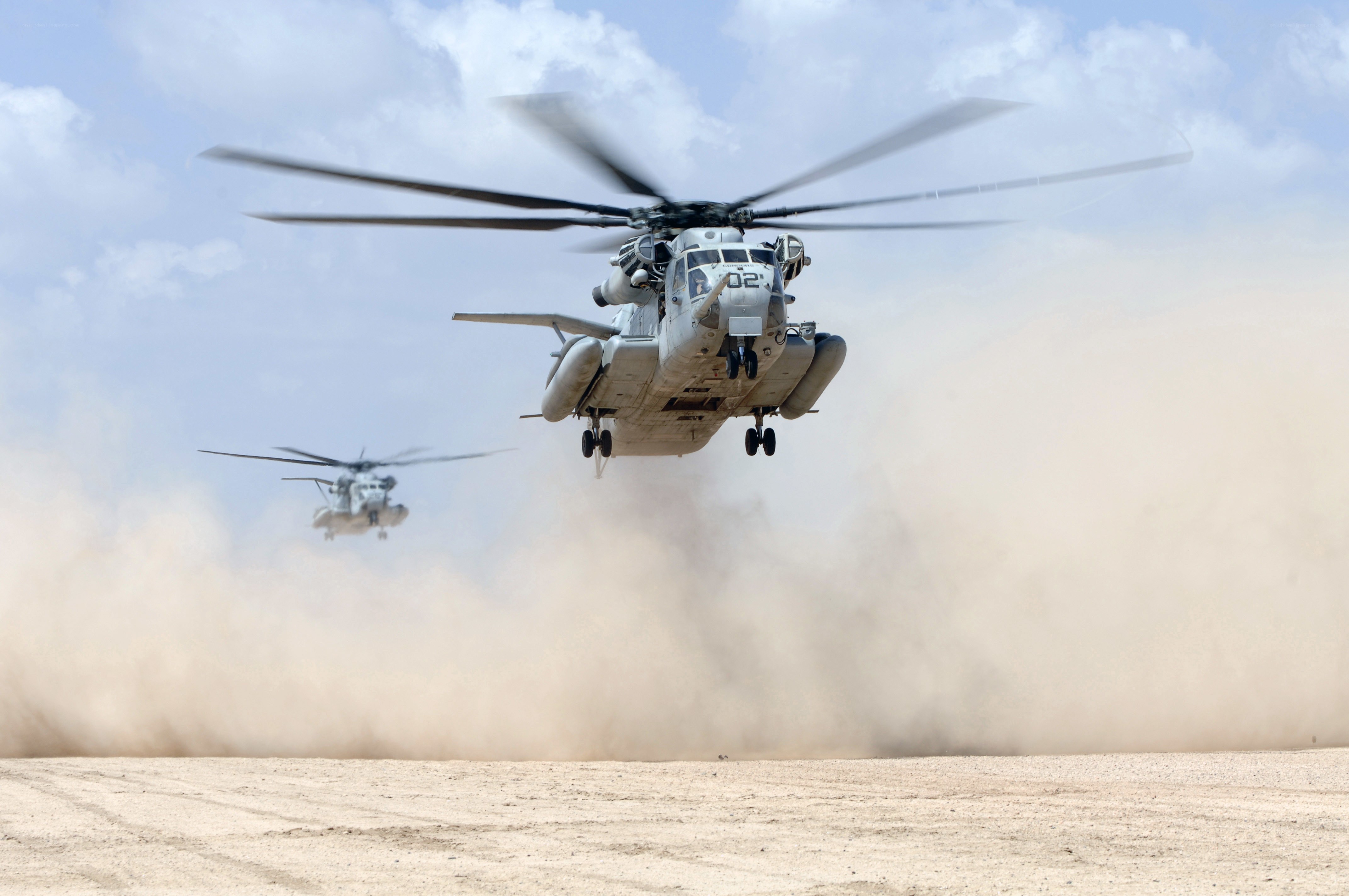 Helicopters in desert dust