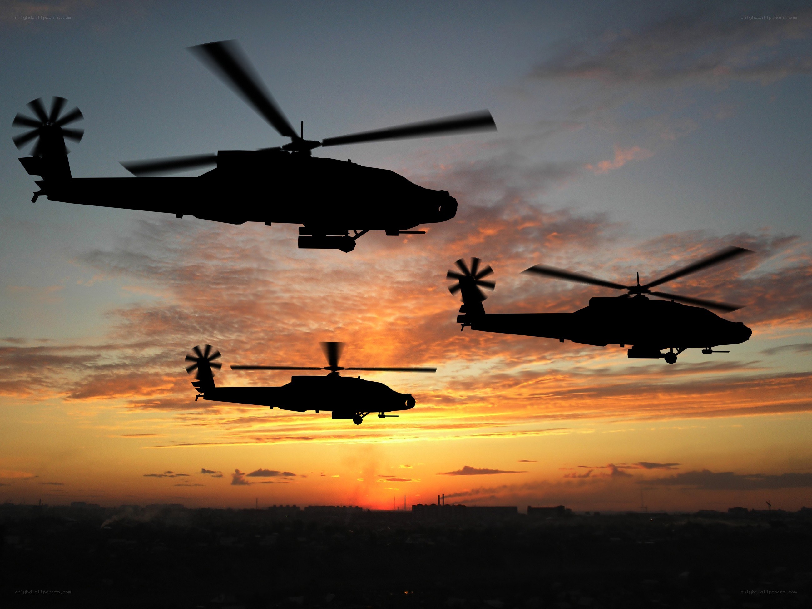 Helicopters in sunset sky