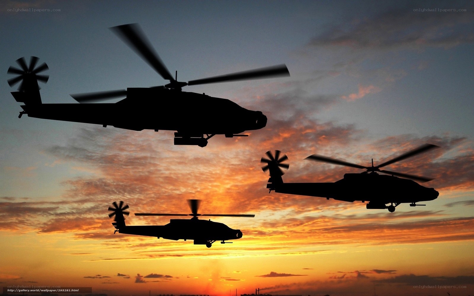 Helicopters in sunset sky