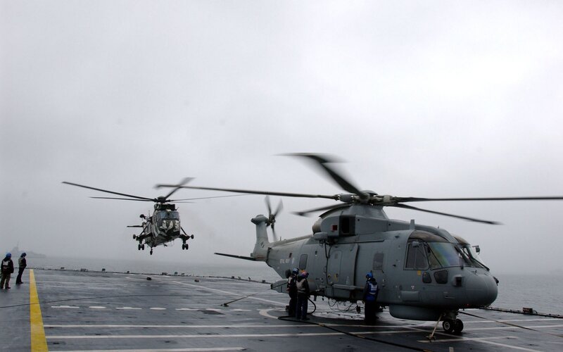 Helicopters on aircraft carrier deck
