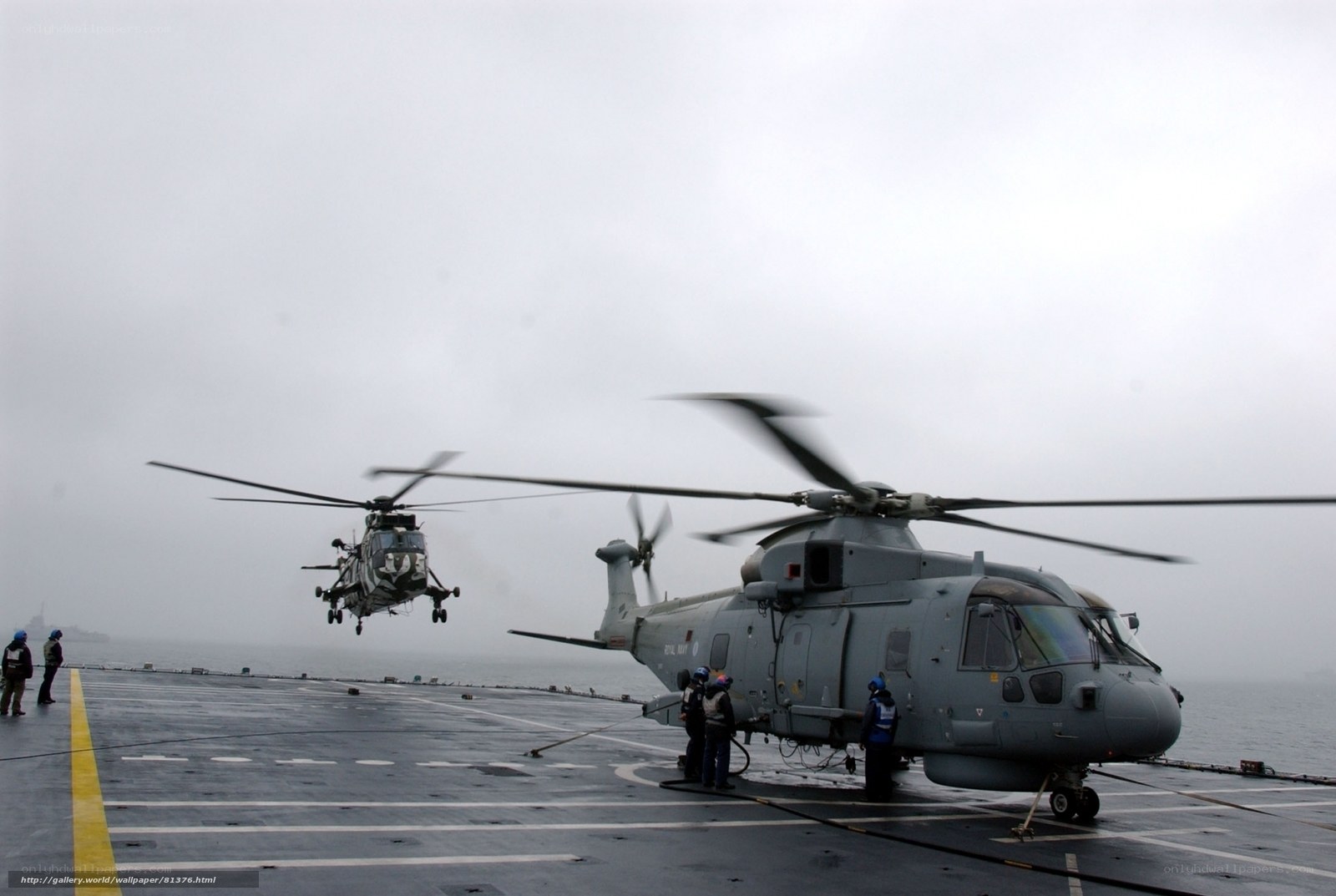 Helicopters on aircraft carrier deck