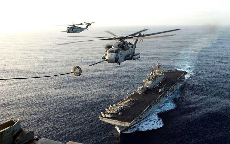 Helicopters over aircraft carrier