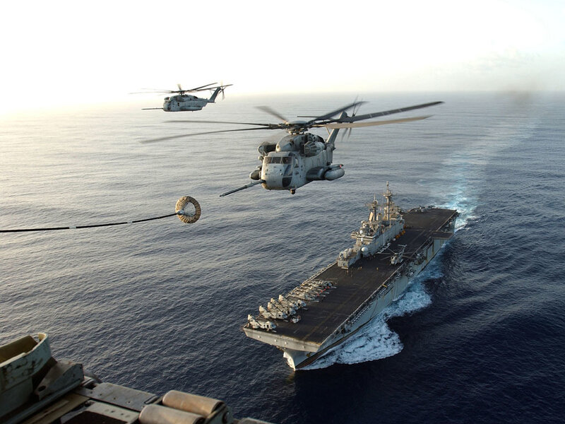 Helicopters over aircraft carrier