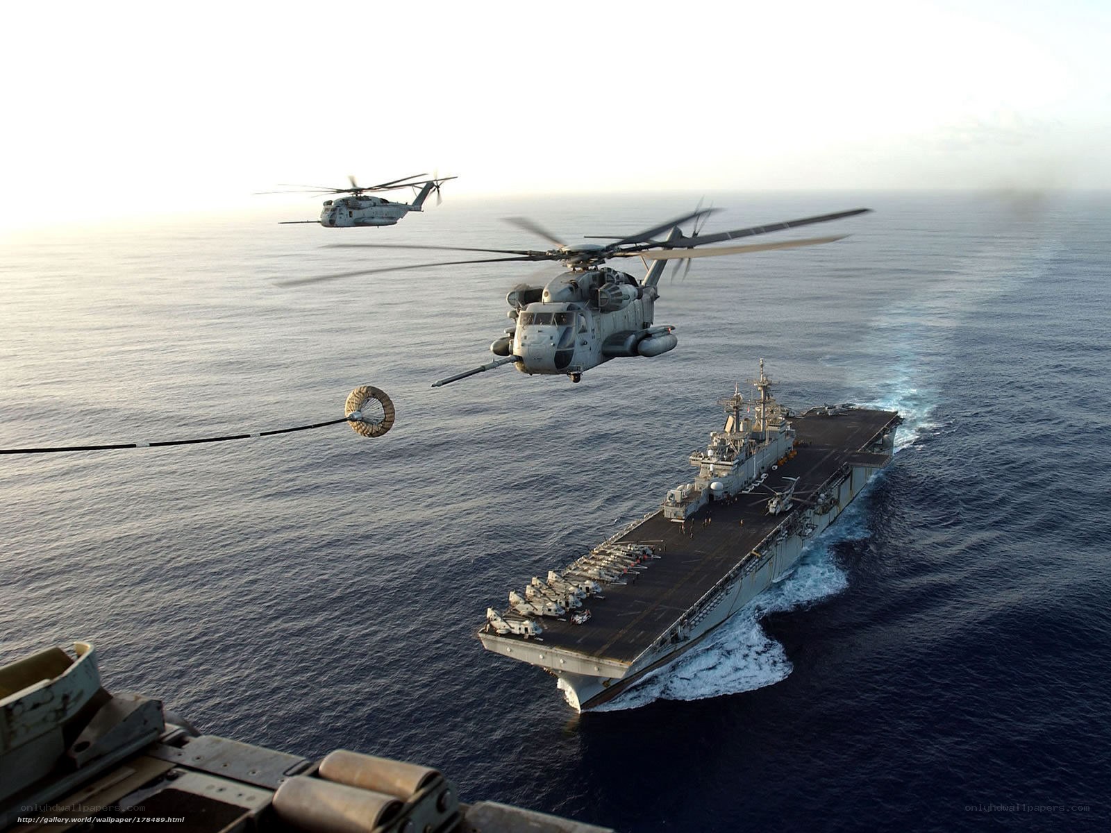 Helicopters over aircraft carrier