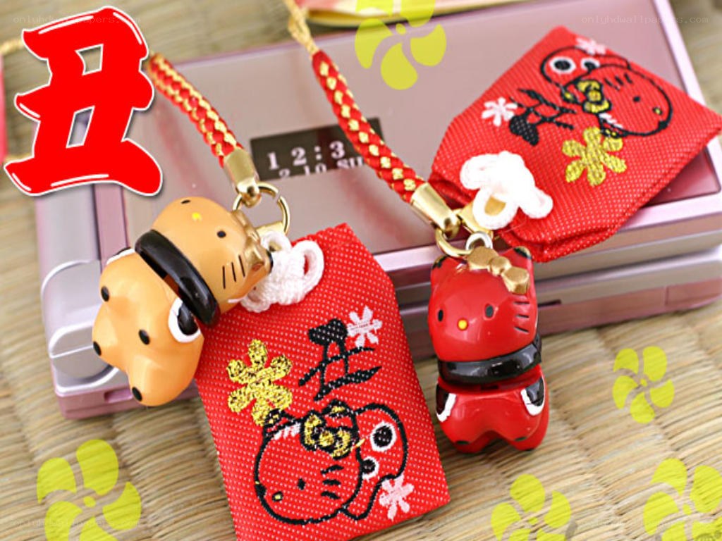 Hello Kitty amulets on phone