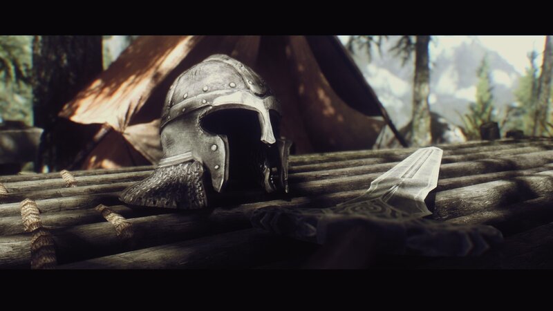 helmet and sword on wooden surface