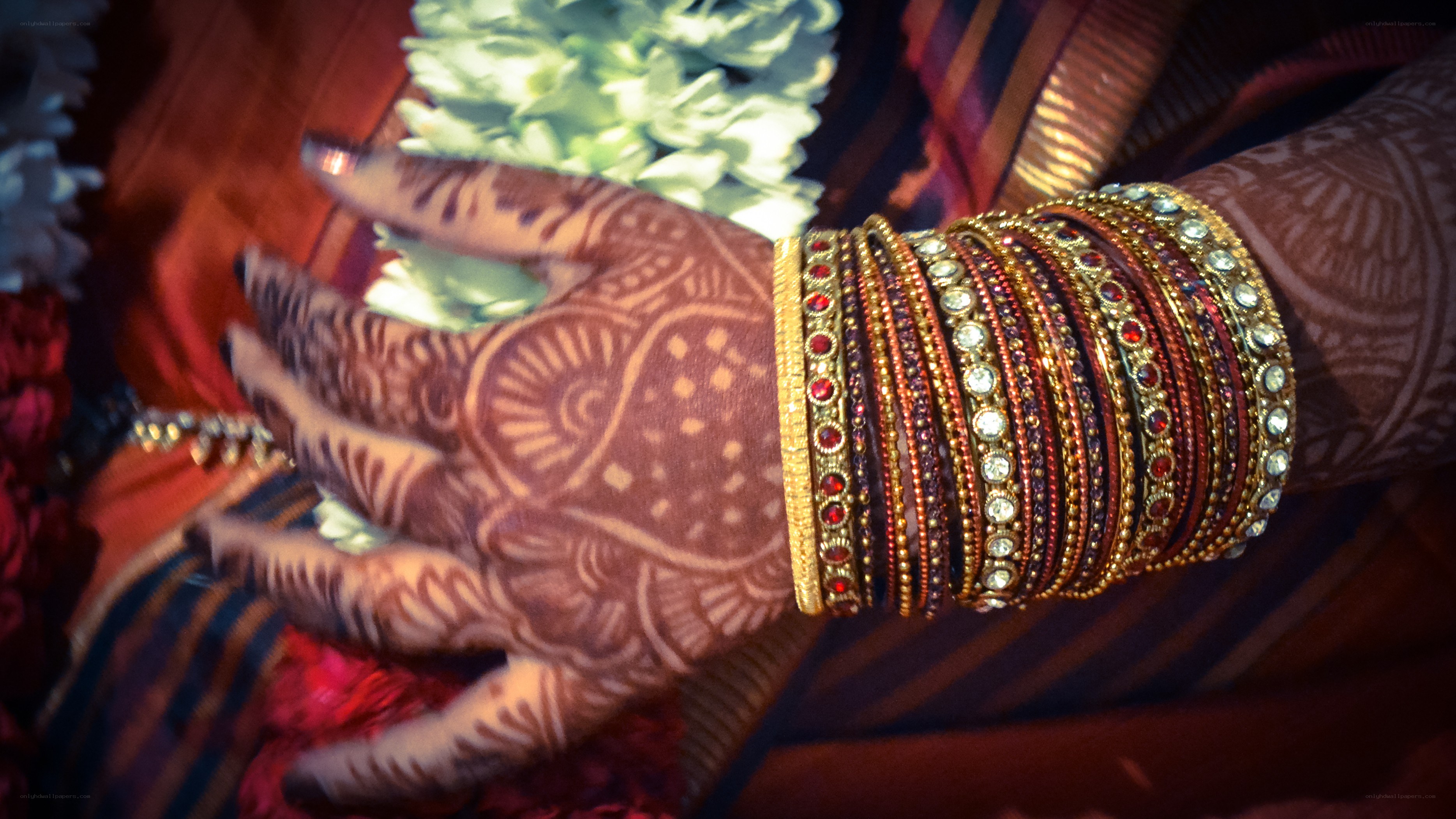 Henna and bangles on a hand