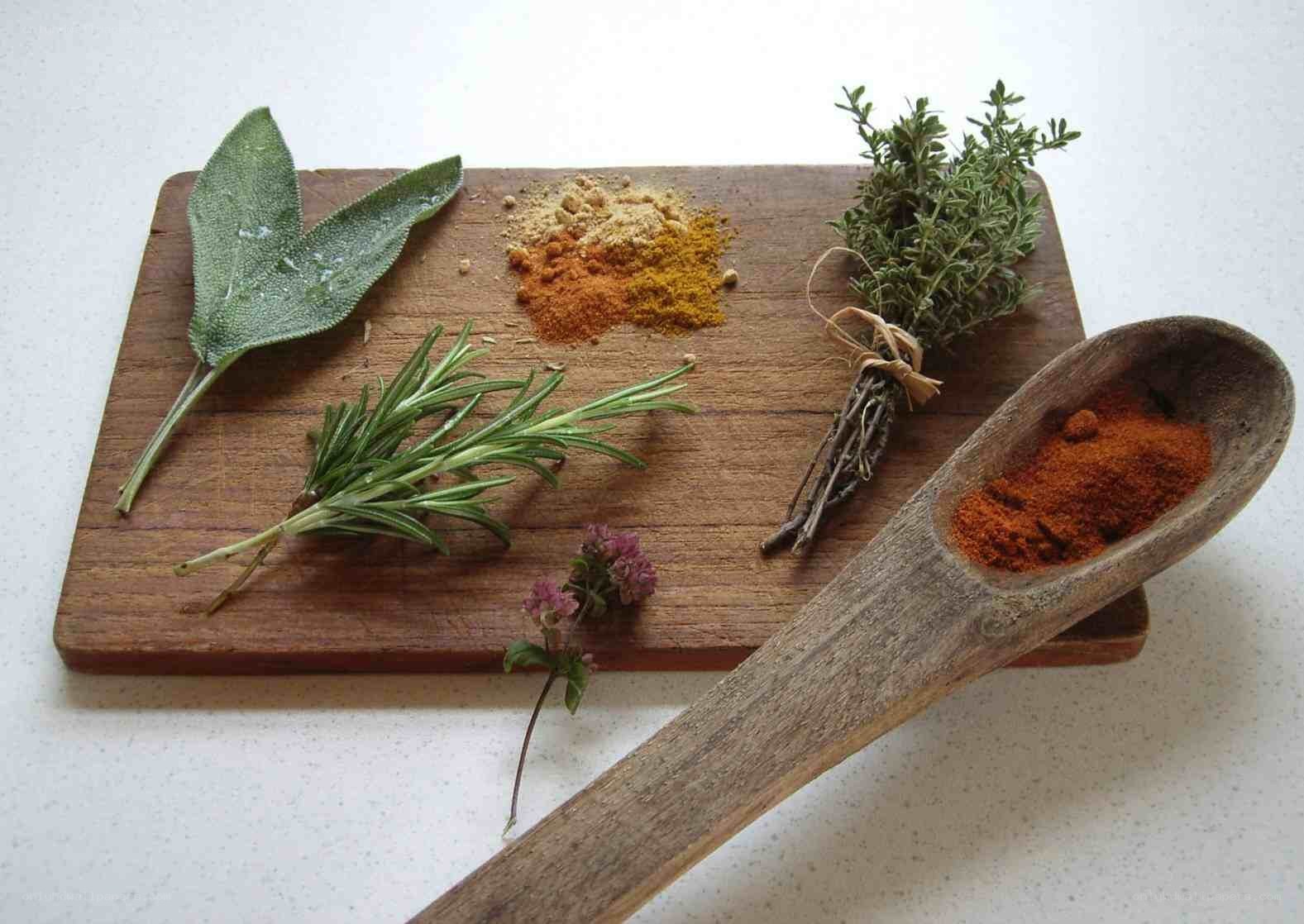 herbs and spices on a cutting board