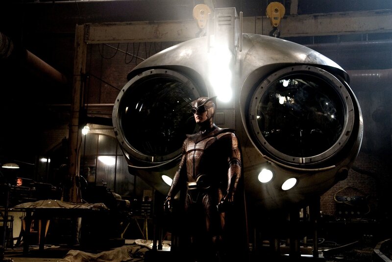 hero stands before futuristic vehicle