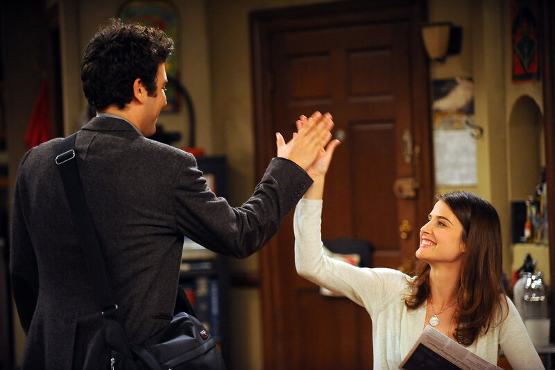 high five between two people