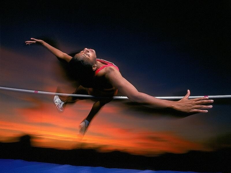 High jumper at sunset