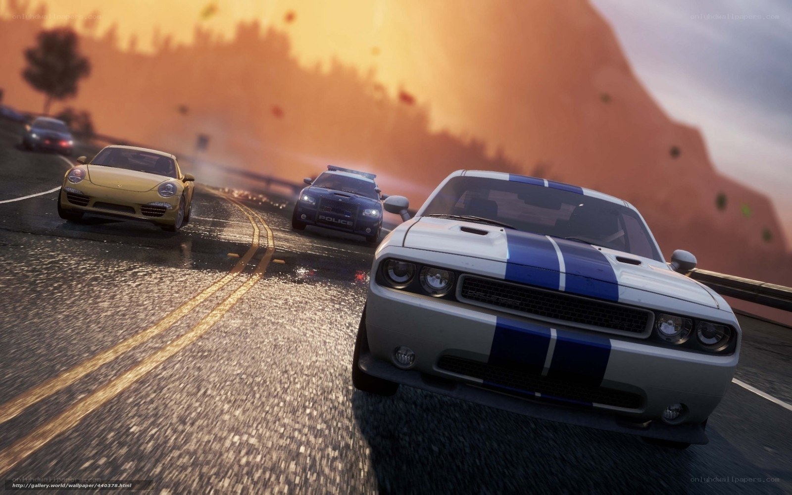 High-speed car chase at sunset