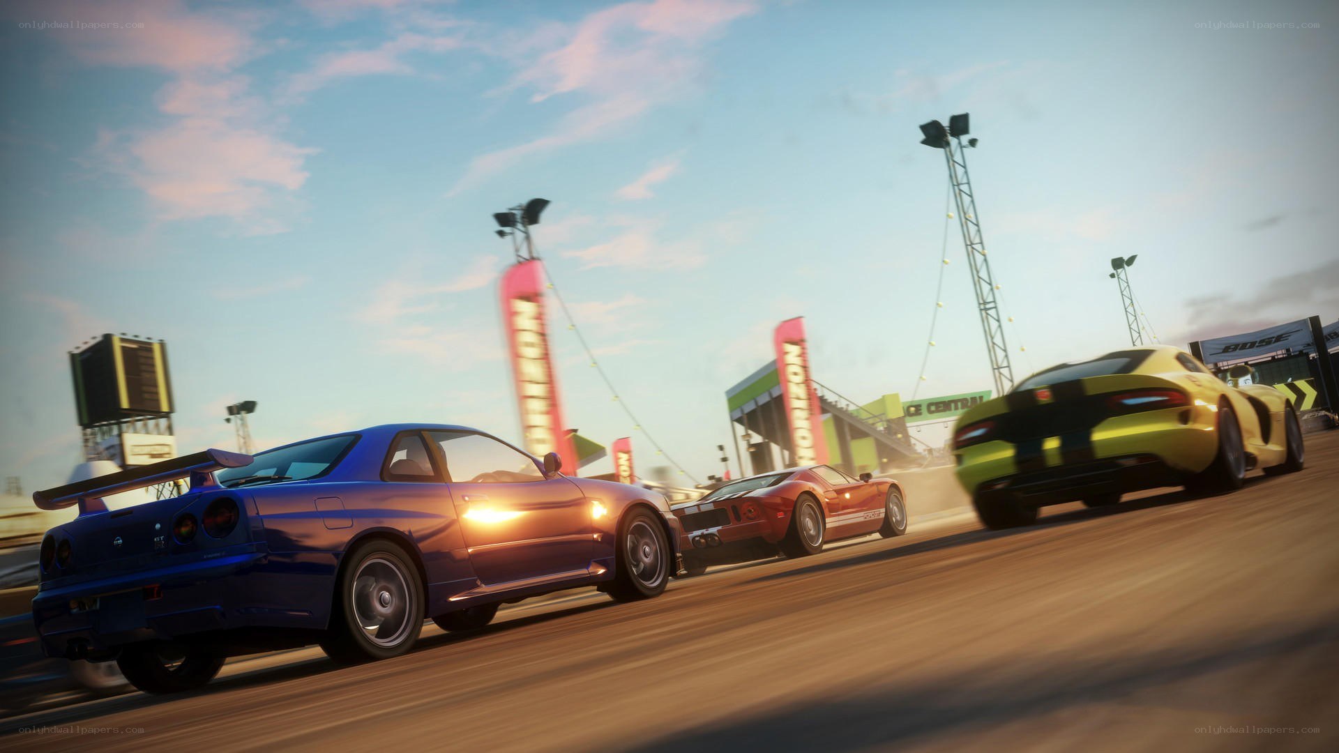 High-speed car race at sunset