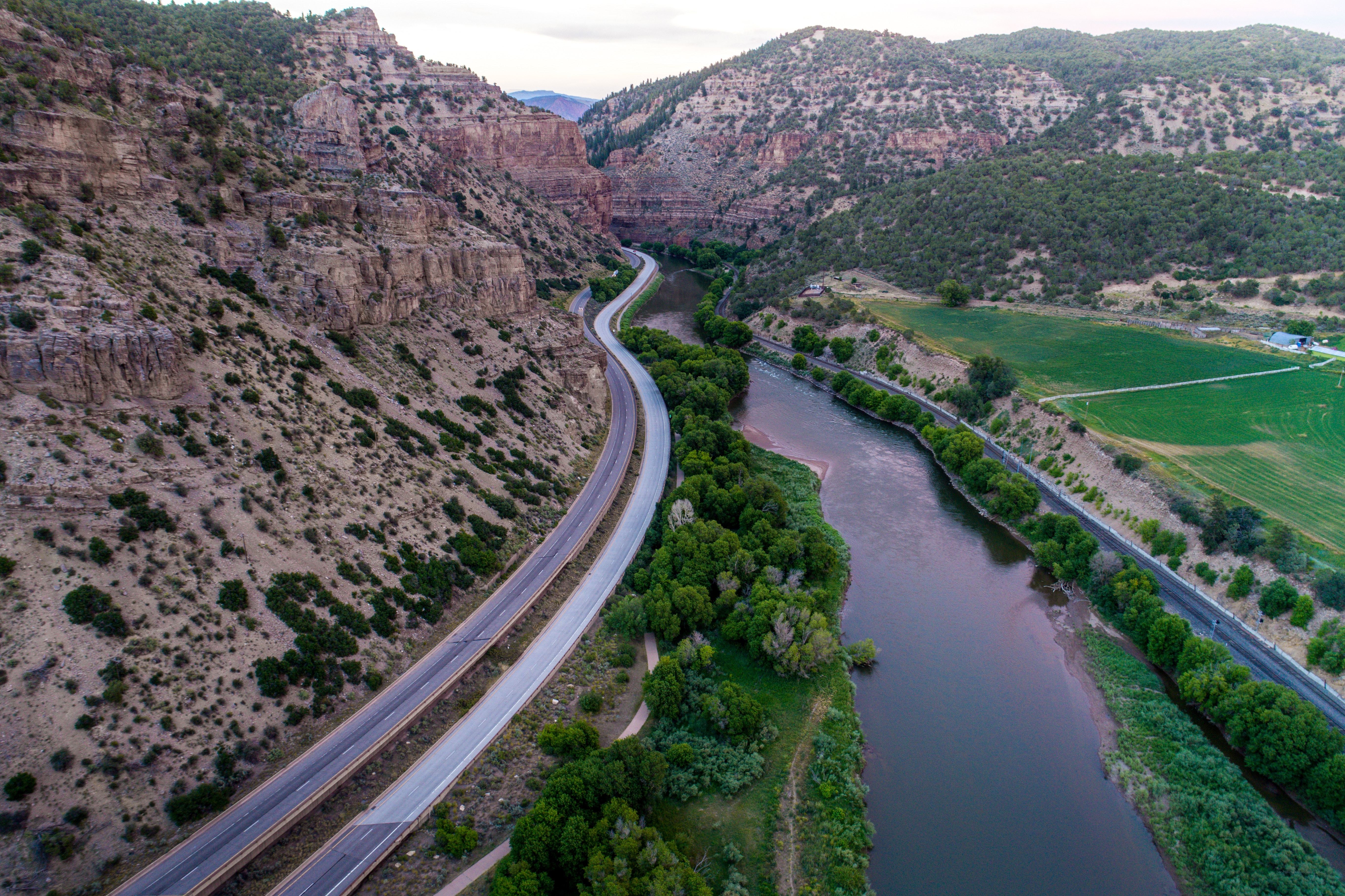 Highway alongside river in canyon