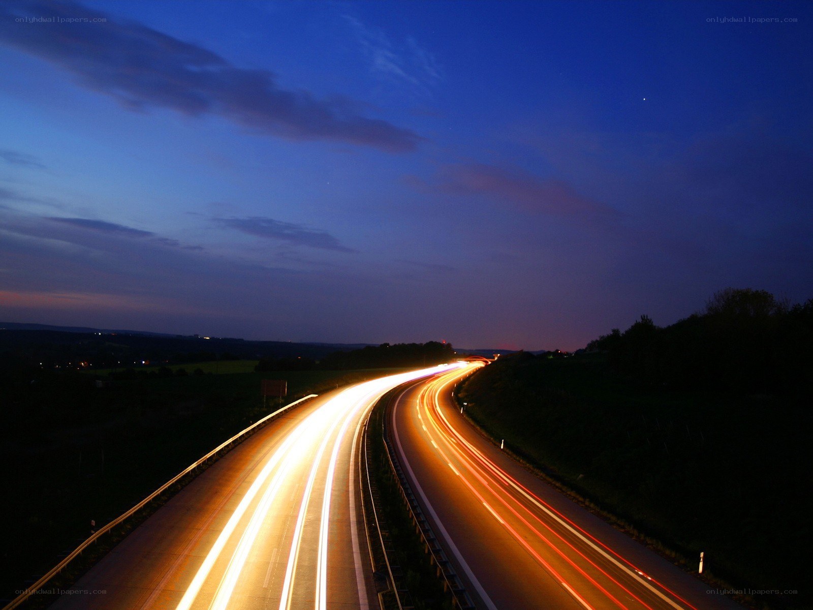 Highway at dusk with light trails