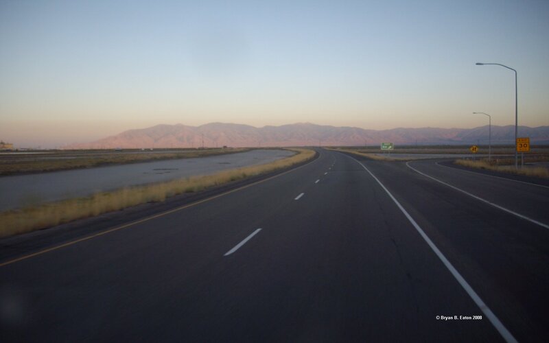 Highway at dusk with mountains