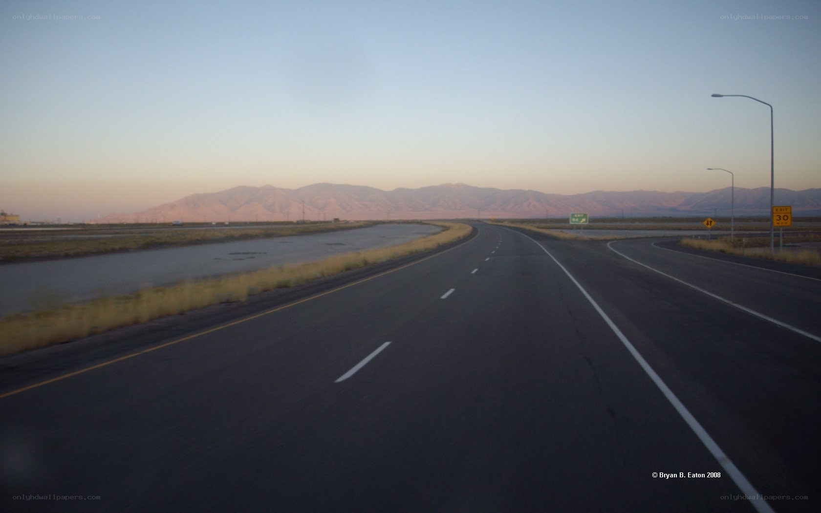Highway at dusk with mountains