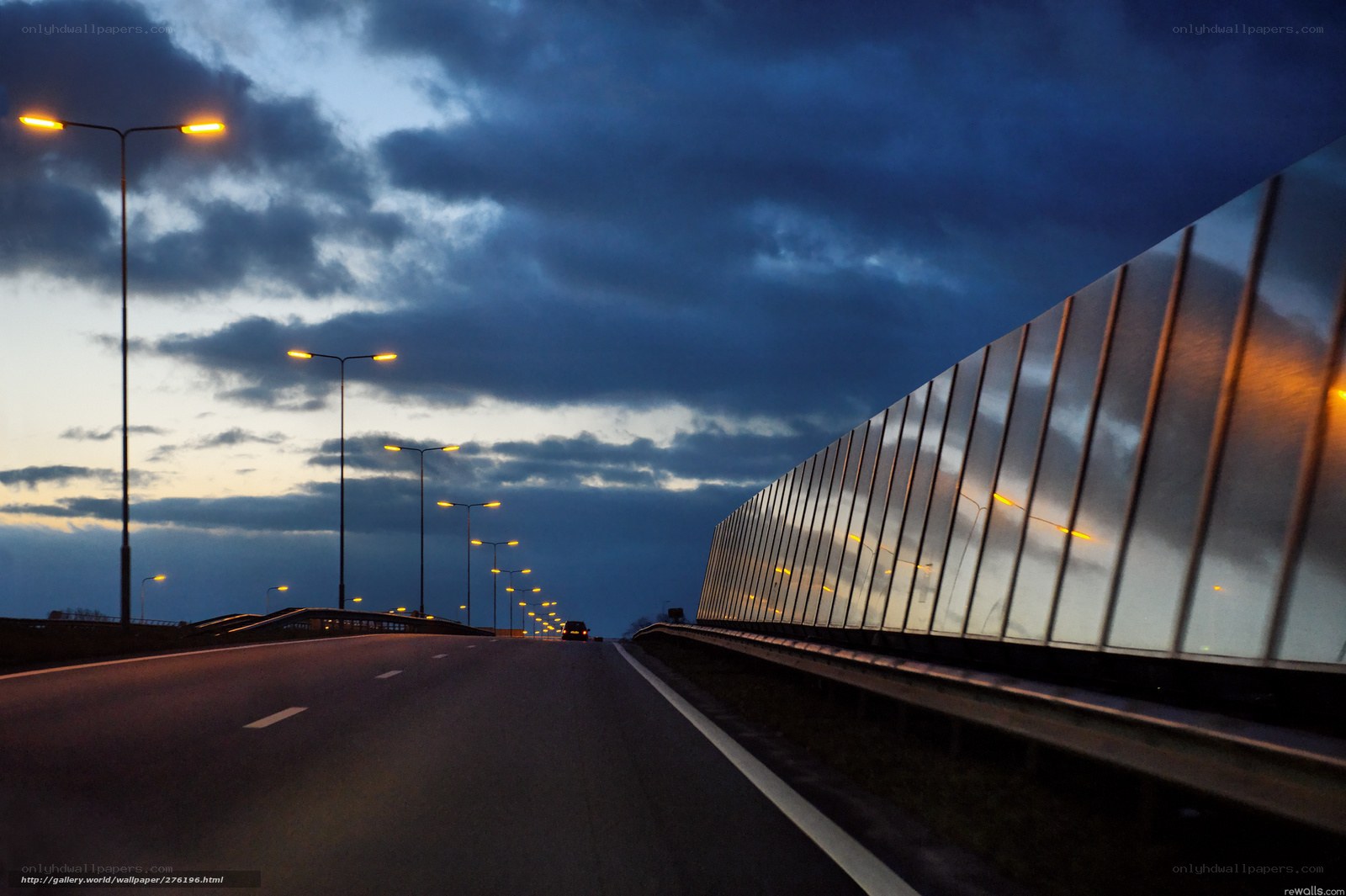 Highway at dusk with sound barrier