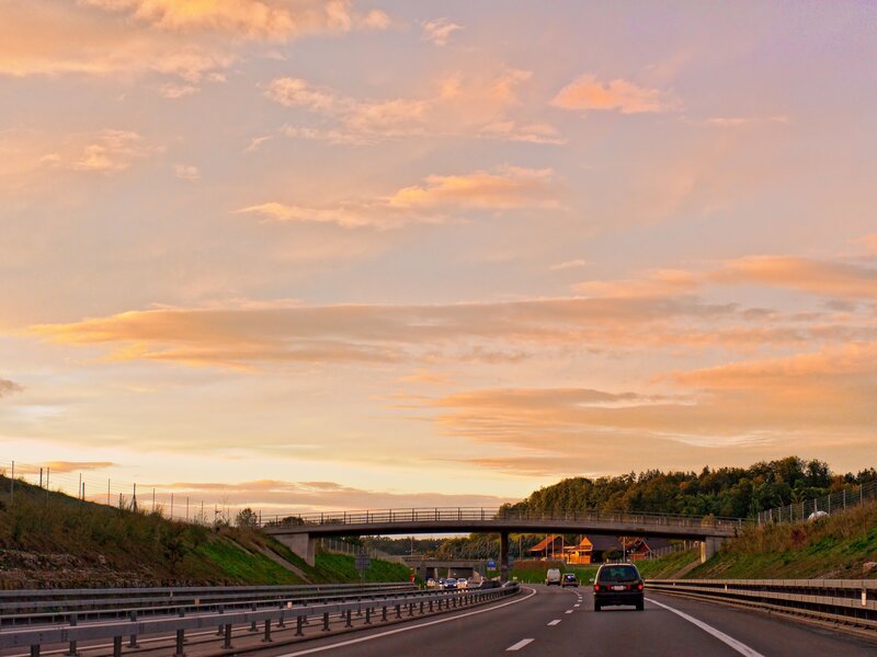 Highway at sunset with bridge