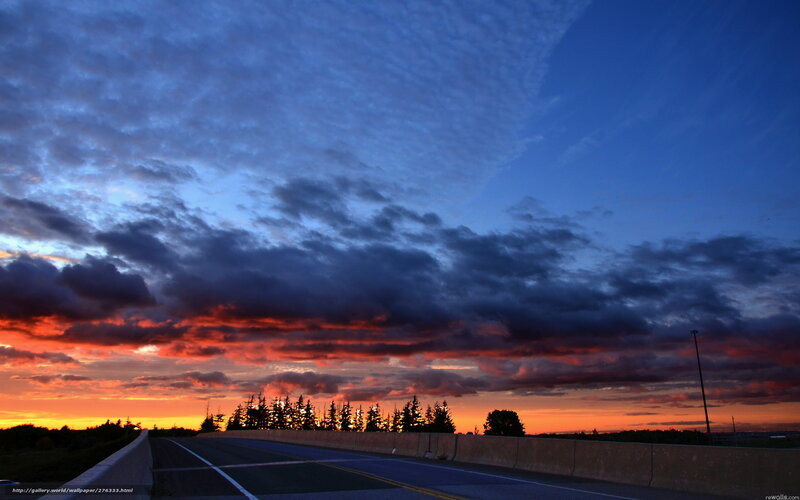 Highway at sunset with dramatic clouds