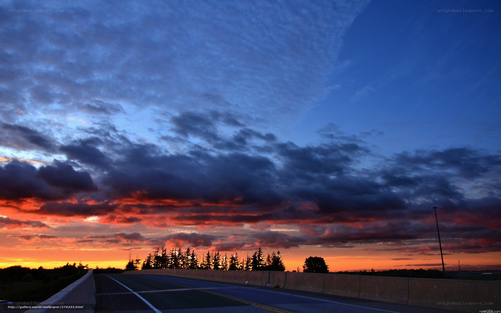 Highway at sunset with dramatic clouds