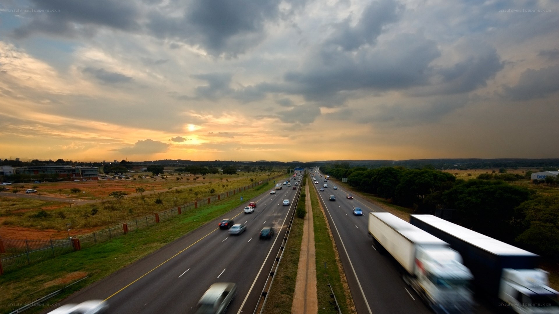 Highway at sunset with traffic