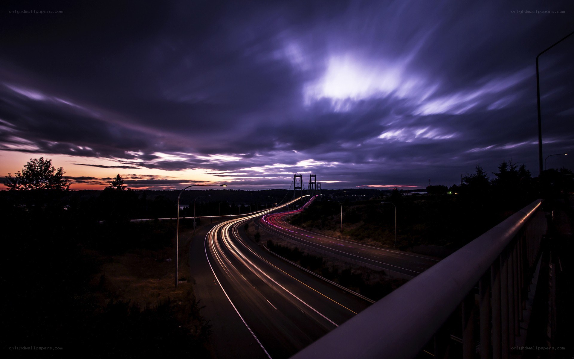 Highway at twilight with light trails