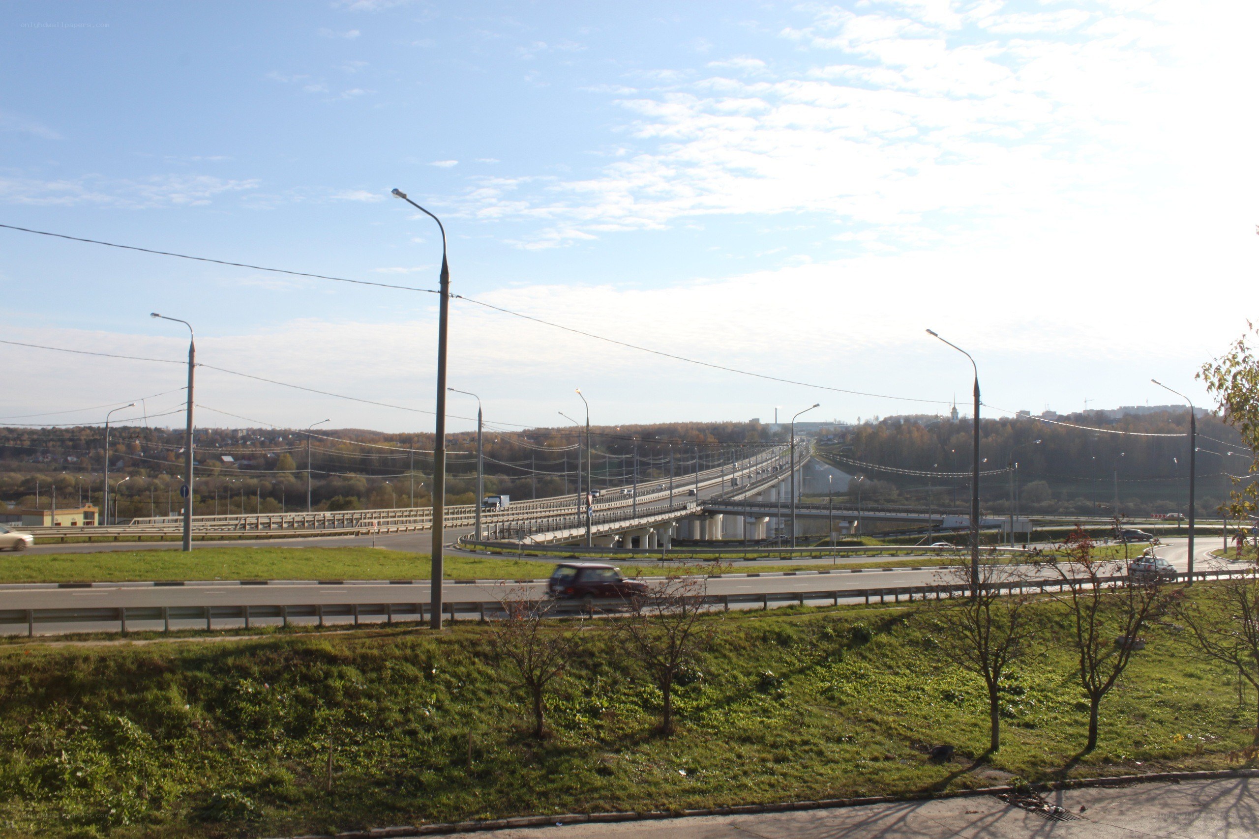 Highway bridge over green landscape