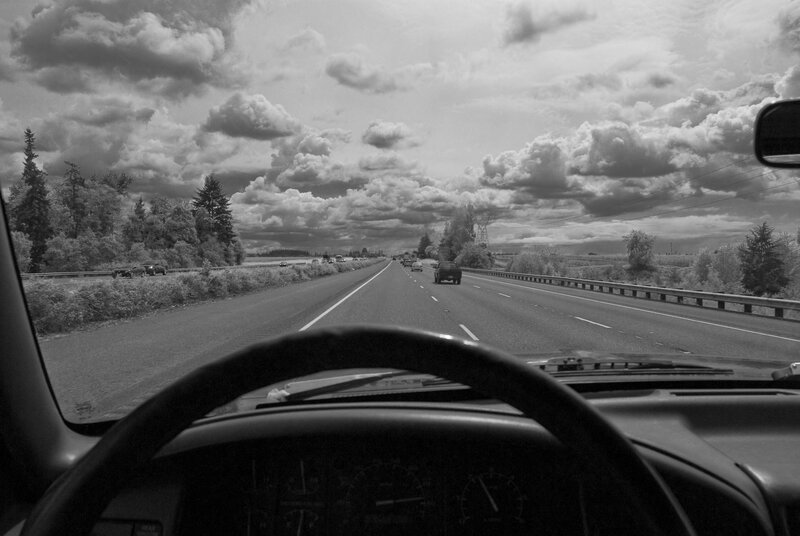 highway drive under cloudy sky