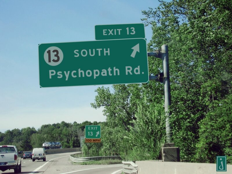 Highway exit sign for Psychopath Rd.