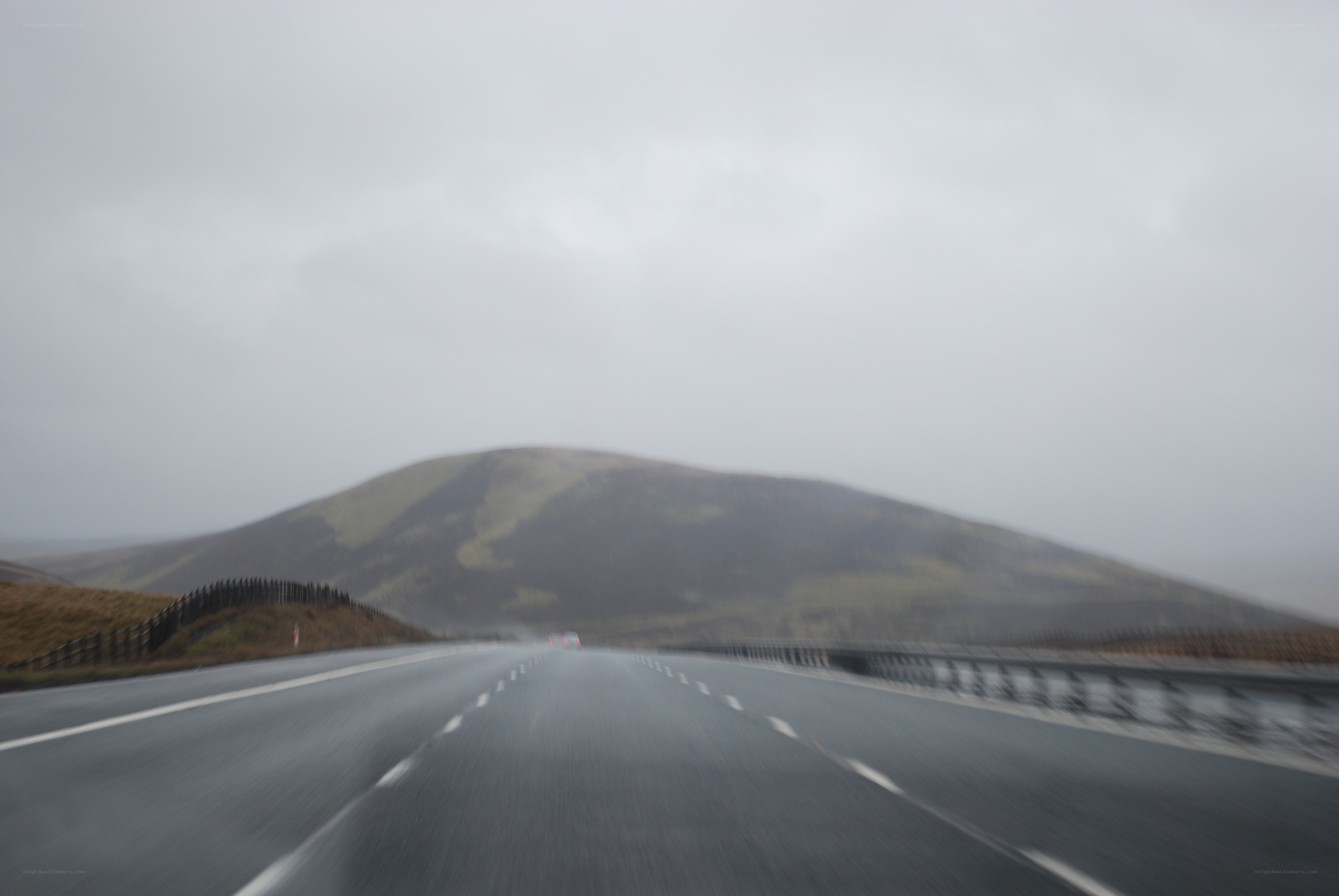 highway in foggy mountains