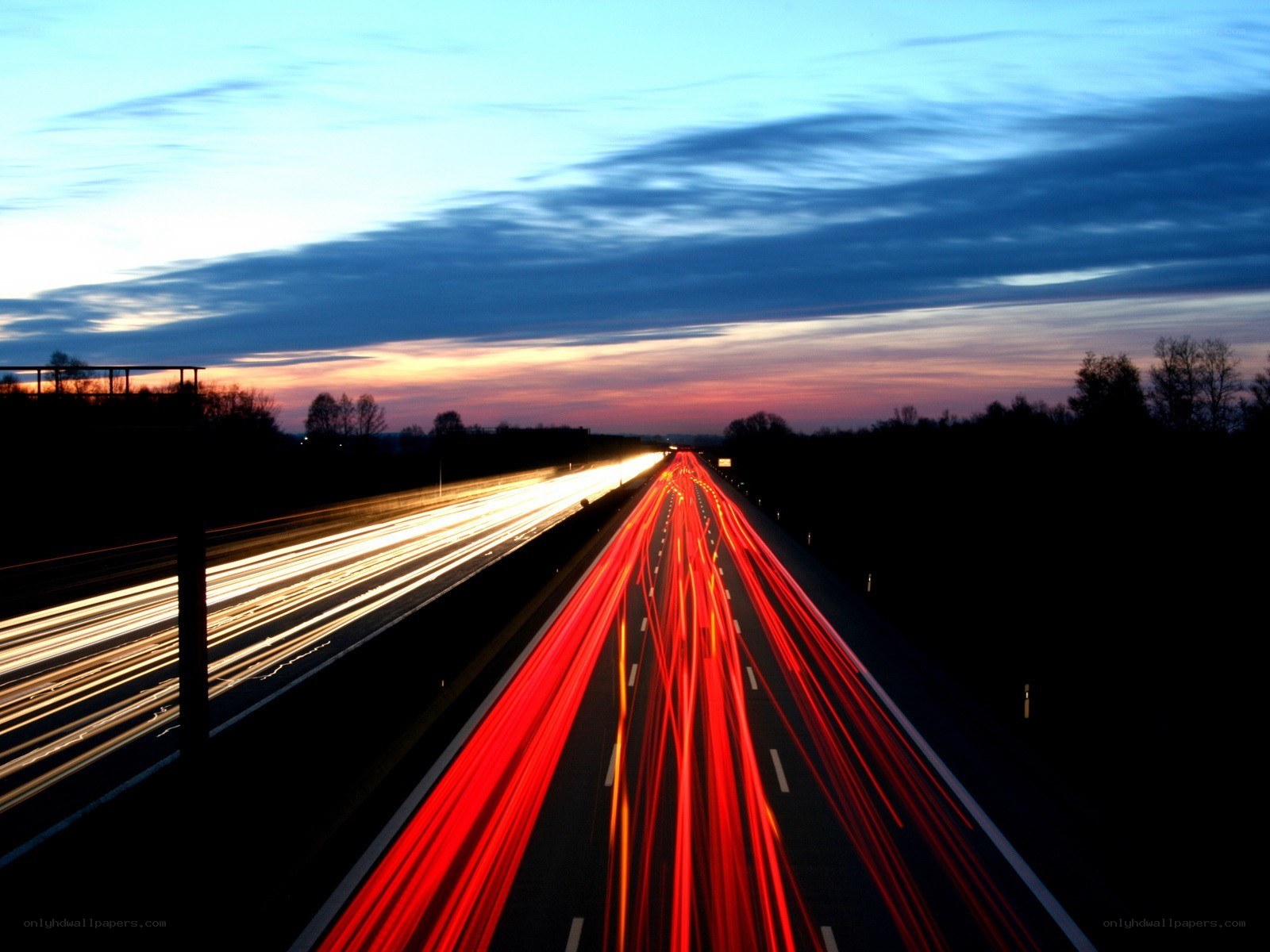 Highway light trails at dusk