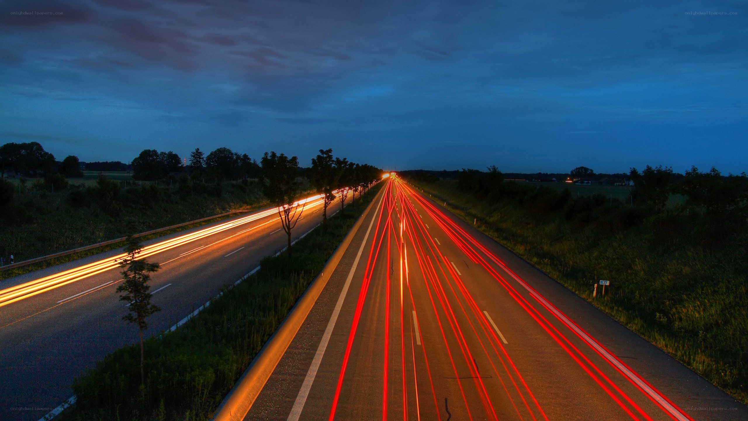 Highway light trails at dusk