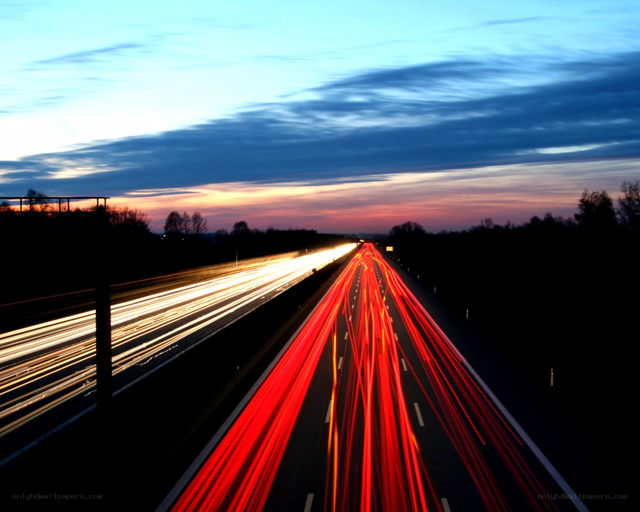 Highway light trails at dusk