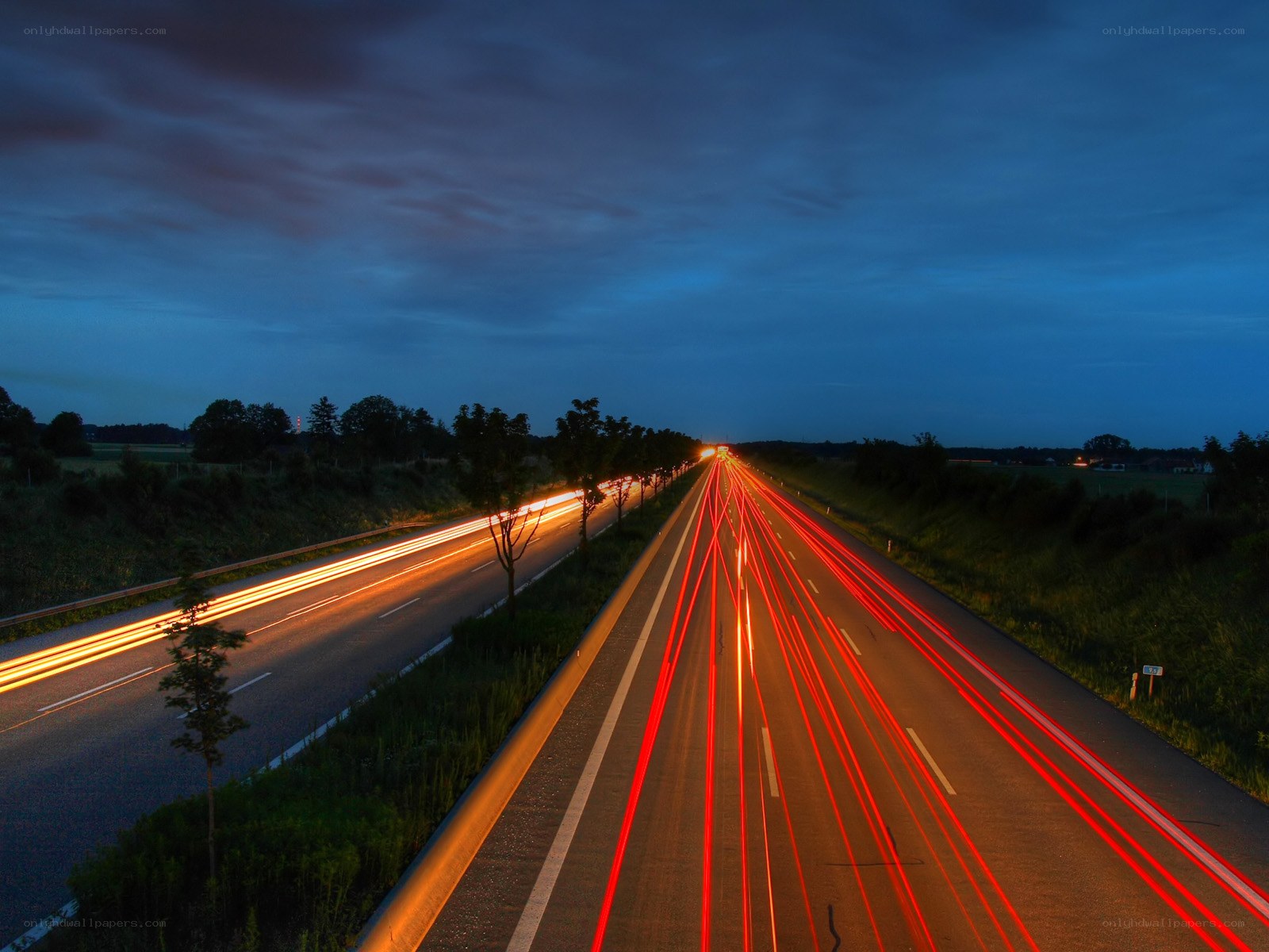 Highway light trails at dusk