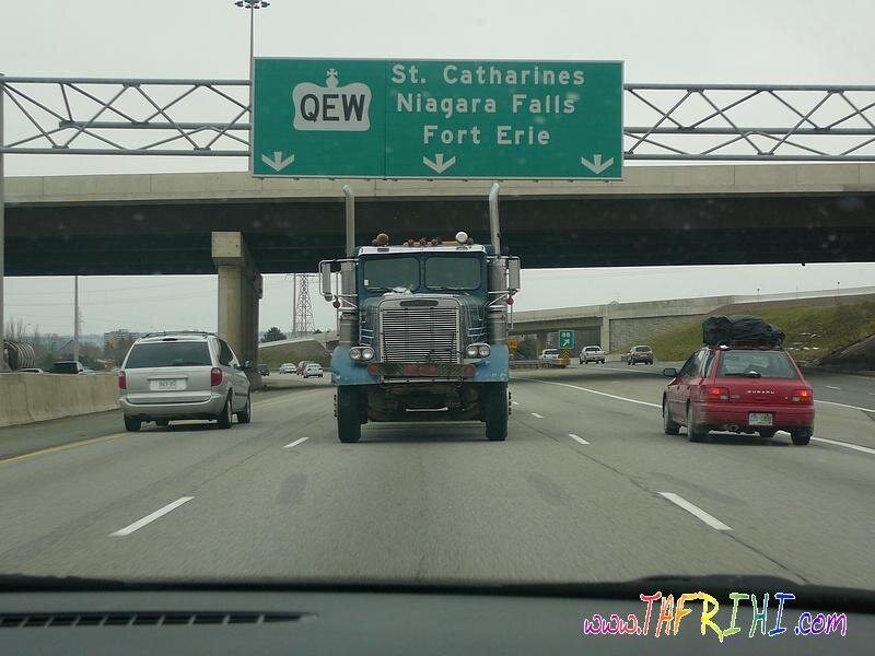 Highway scene with trucks and cars