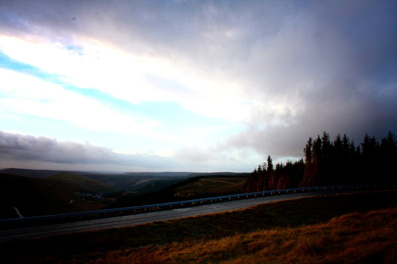 Highway through a valley at dusk