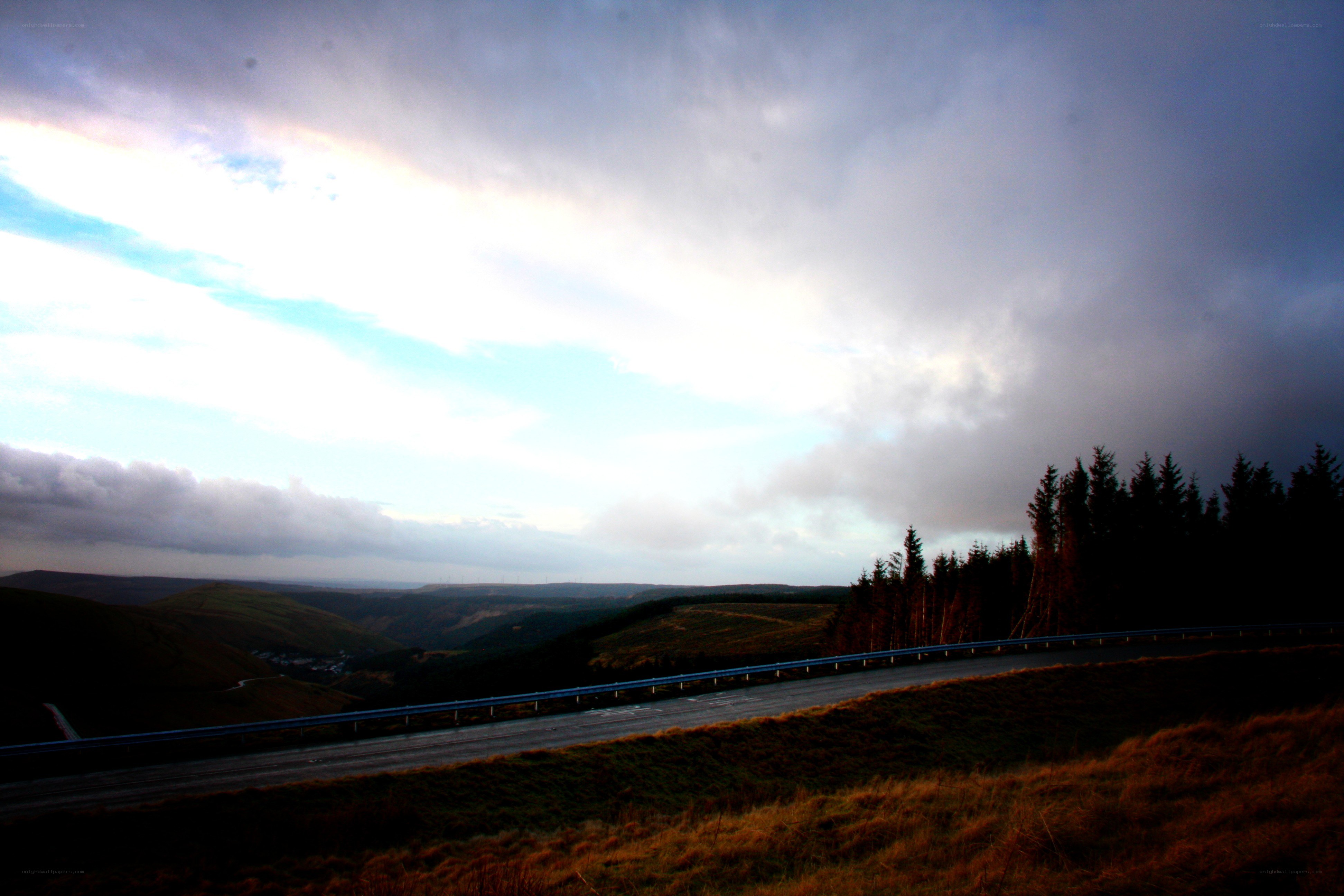 Highway through a valley at dusk