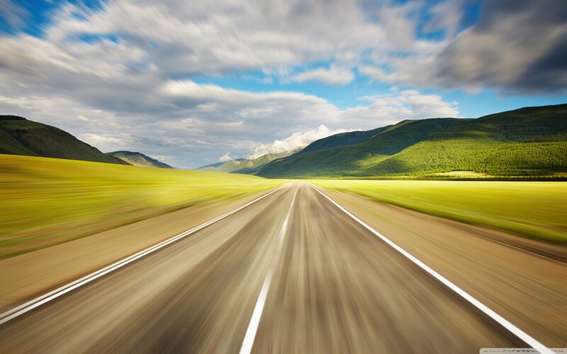 Highway through green valley