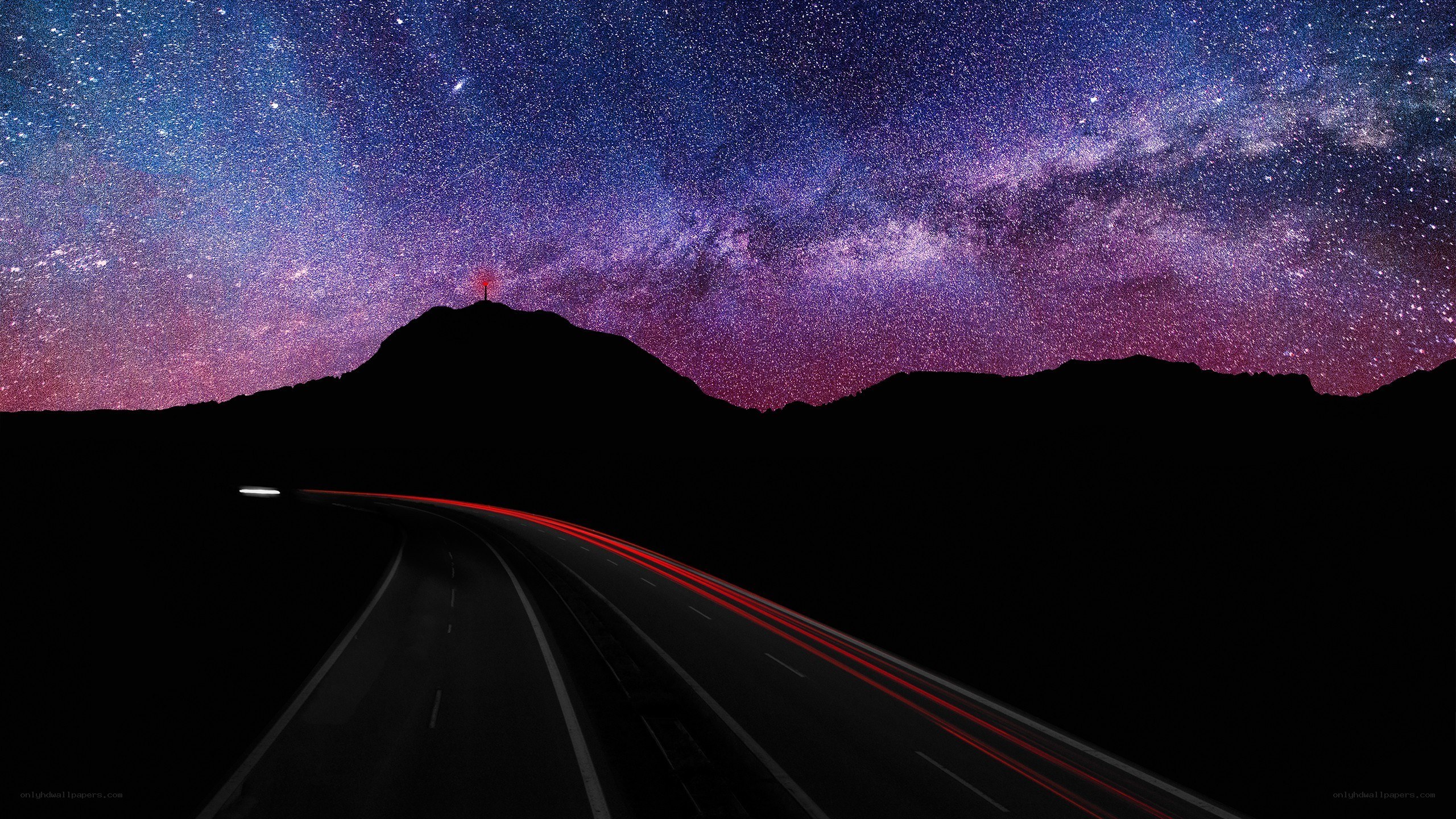Highway under starry sky