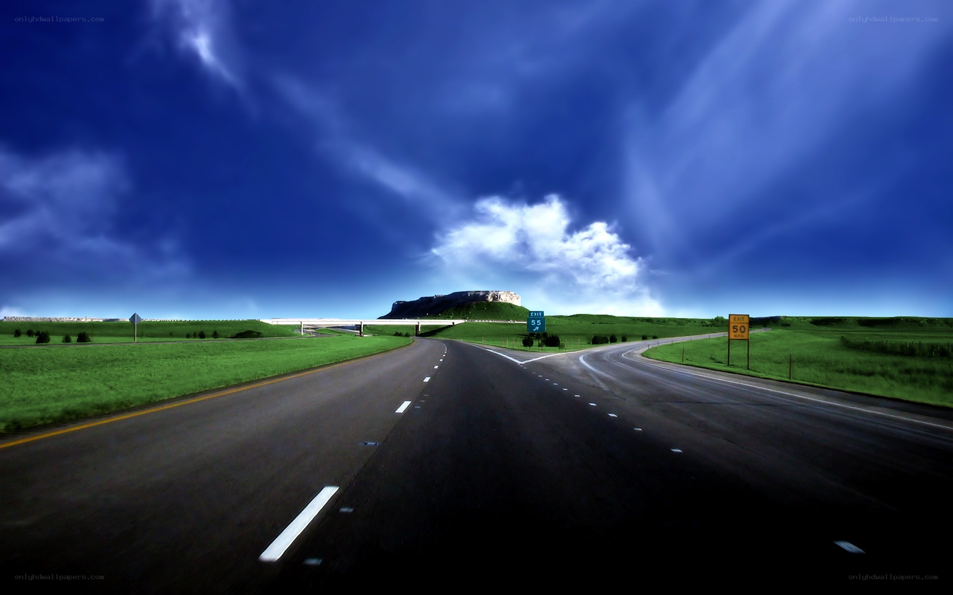 Highway under stormy sky