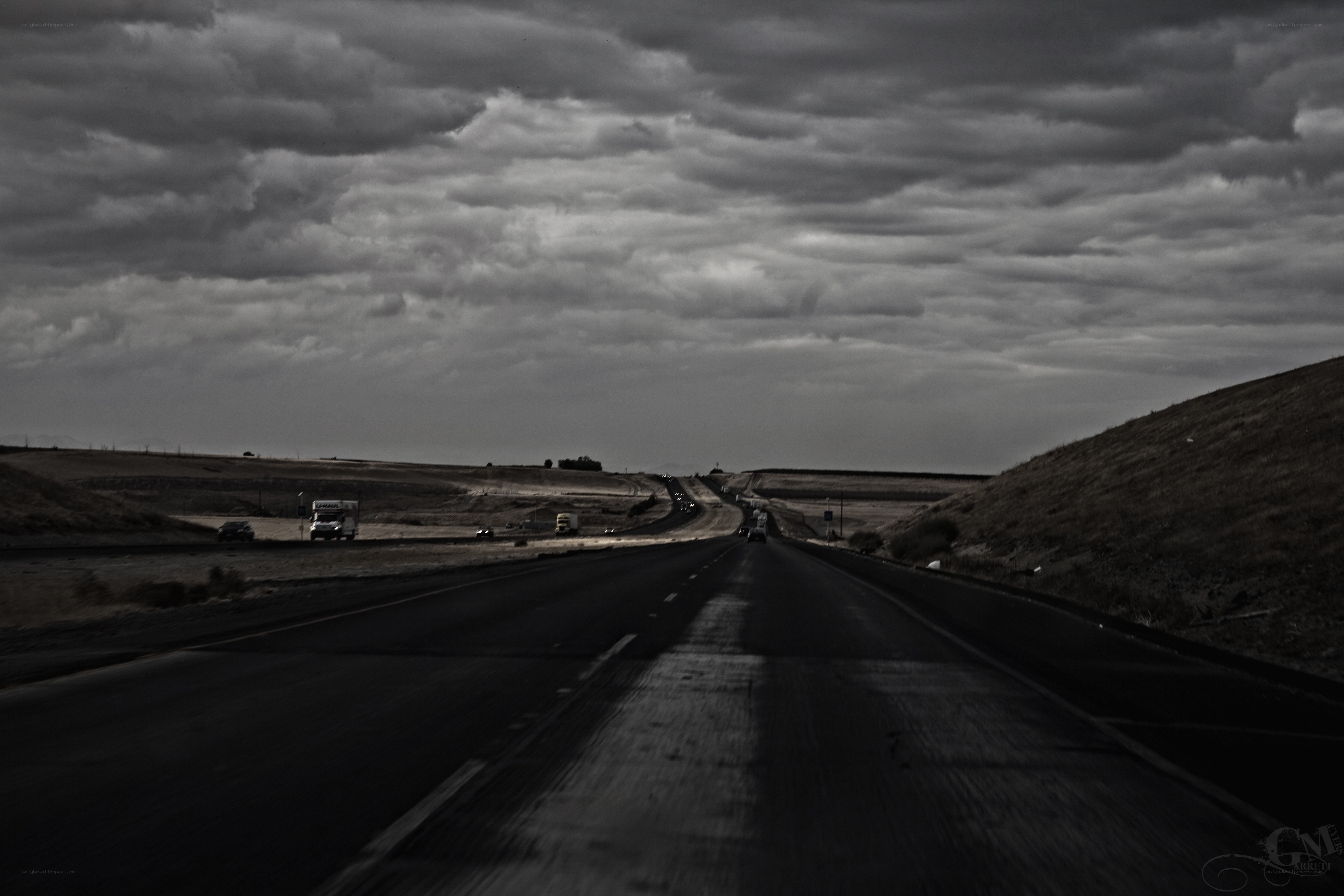 Highway under stormy sky