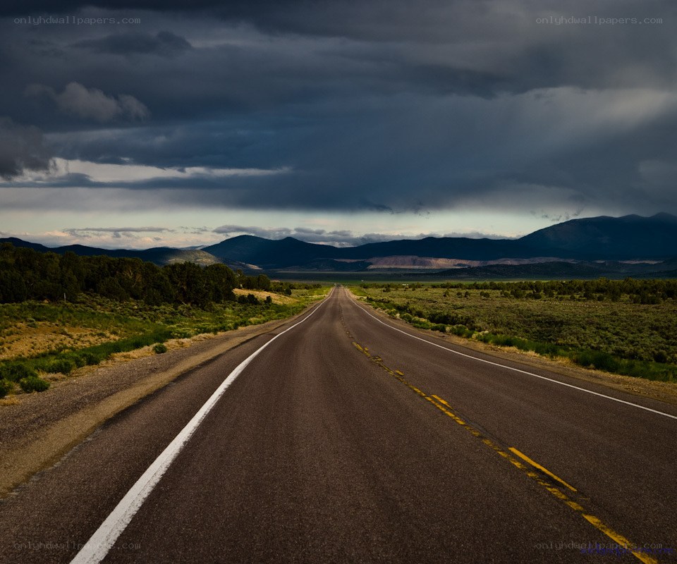 Highway under stormy sky