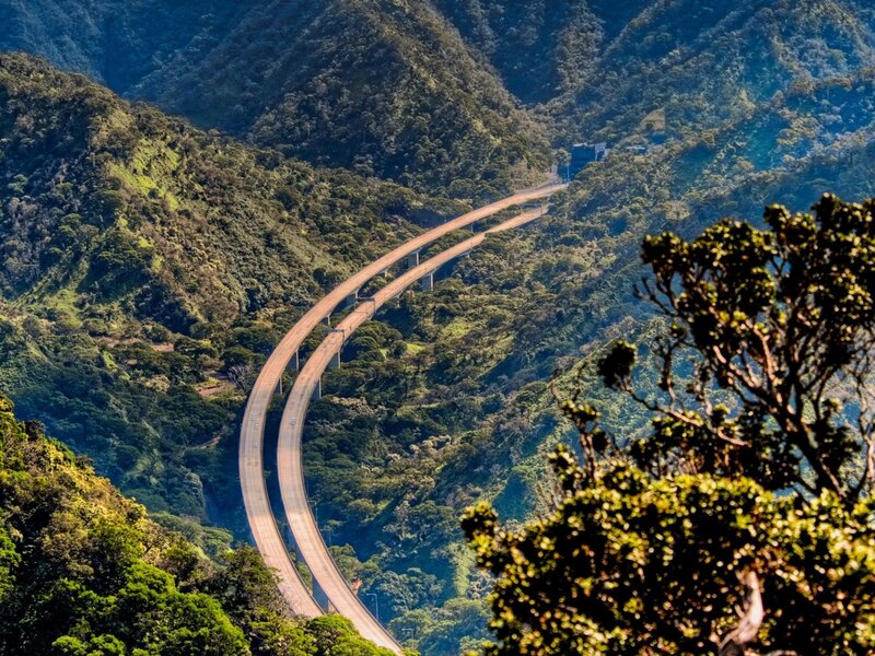 Highway winding through lush mountains