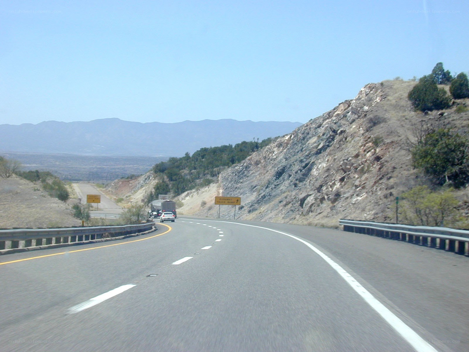 Highway winding through mountainous terrain