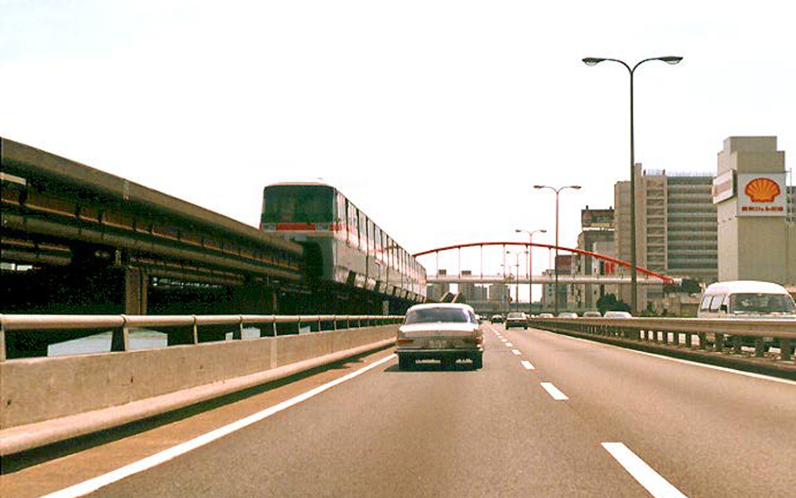 Highway with monorail and Shell station