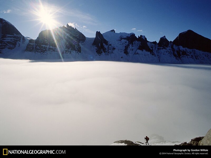 Hiker above the clouds