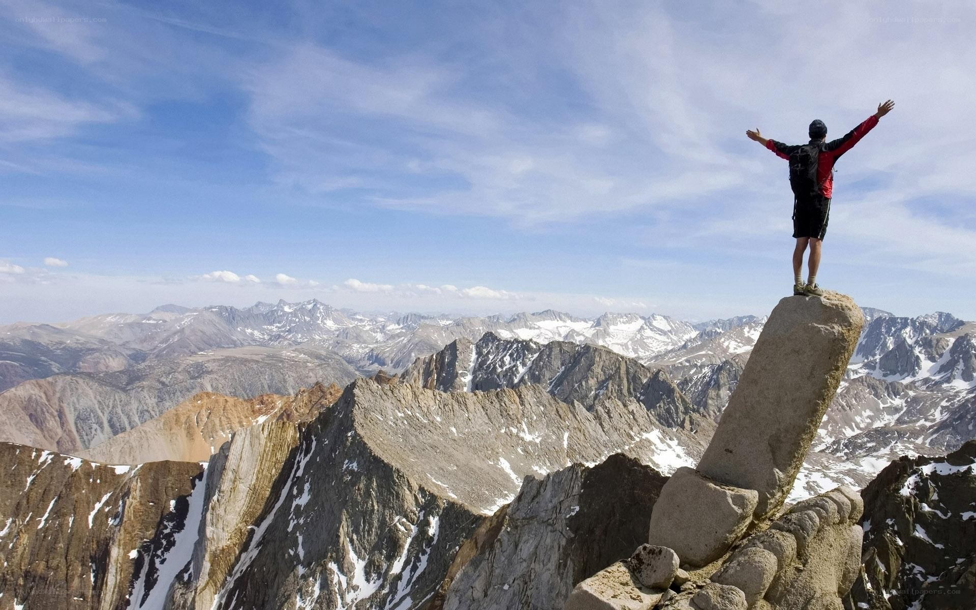 Hiker celebrates mountain summit
