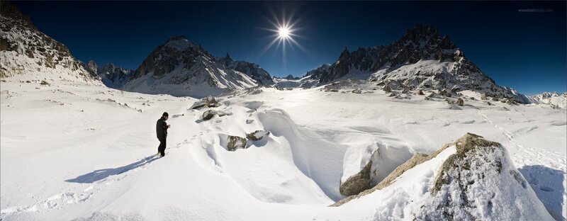 Hiker in snowy mountain landscape